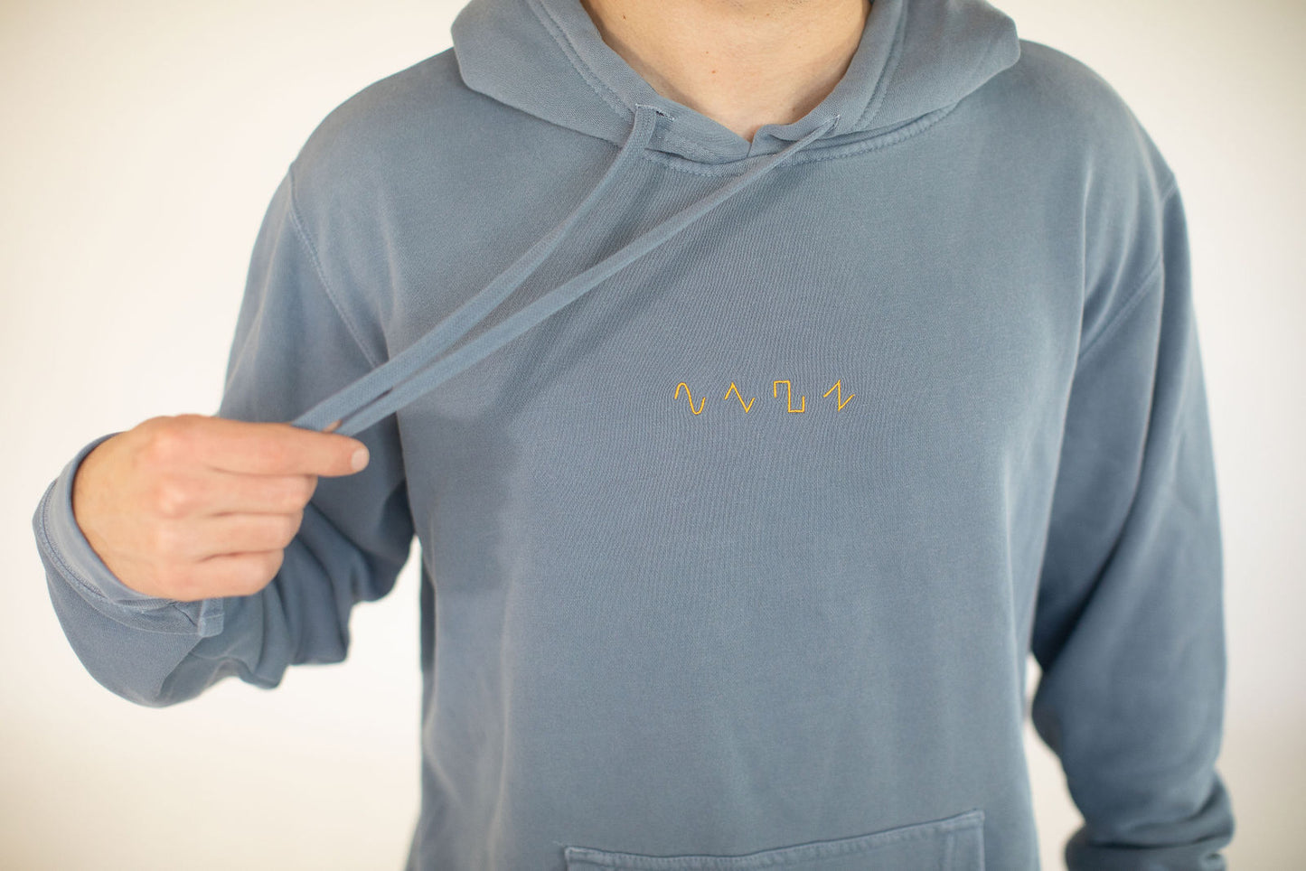 Dezolent Basic Shapes Slate Blue Pigment Dyed Hoodie Close Up Embroidery Model Photo: Sine Wave, Triangle Wave, Square Wave, Sawtooth Wave